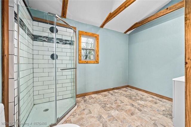 bathroom with vaulted ceiling with beams and a shower with shower door