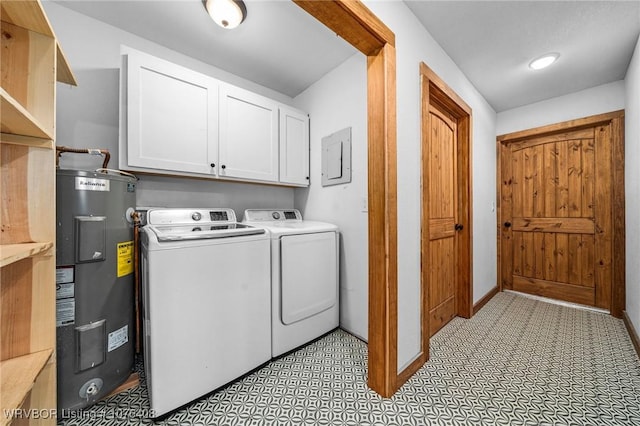 laundry area with cabinets, separate washer and dryer, and water heater