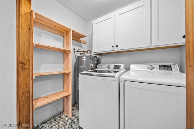 laundry area with separate washer and dryer, electric water heater, and cabinets