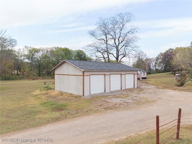 garage with a lawn