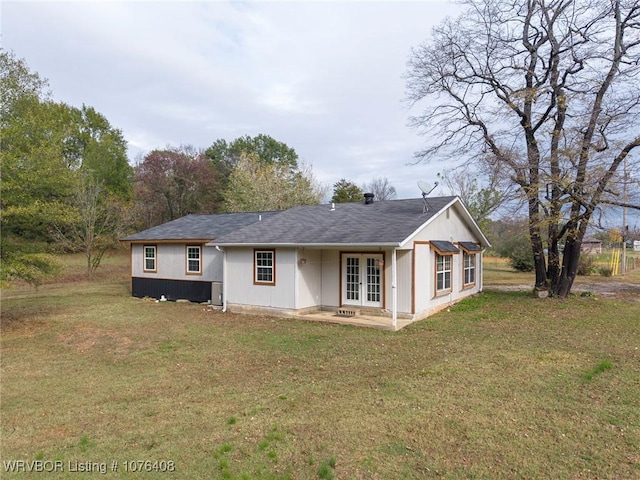 back of house with french doors, a yard, and a patio