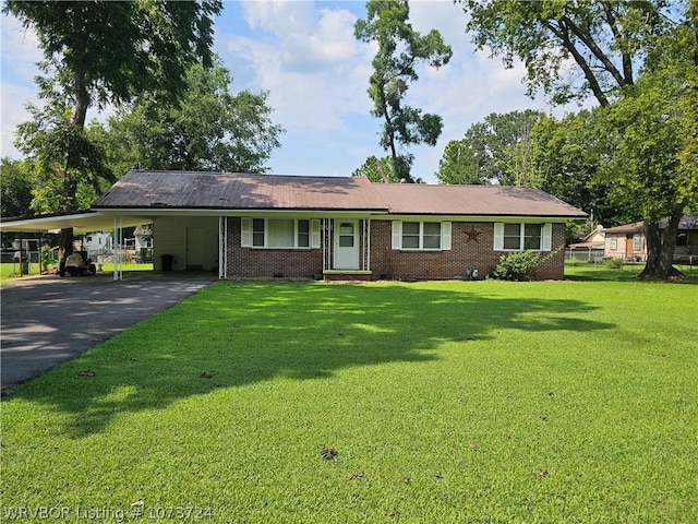 ranch-style home featuring a front yard and a carport