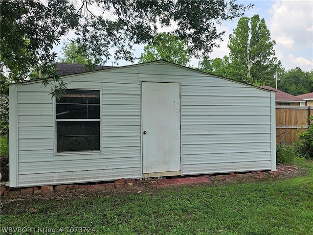 view of outdoor structure with a yard