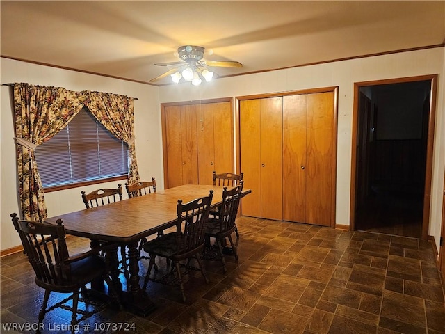 dining space featuring ceiling fan and ornamental molding