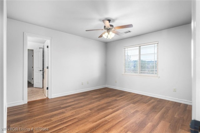 8815 Lakeside Way, Fort Smith, AR 72903 - spare room with a ceiling fan, wood finished floors, and baseboards