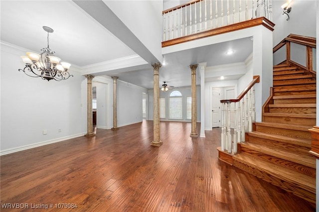 8815 Lakeside Way, Fort Smith, AR 72903 - foyer entrance with decorative columns, a chandelier, crown molding, wood finished floors, and stairway