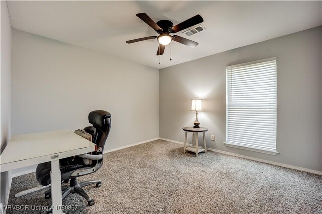 office with a ceiling fan, carpet flooring, and baseboards