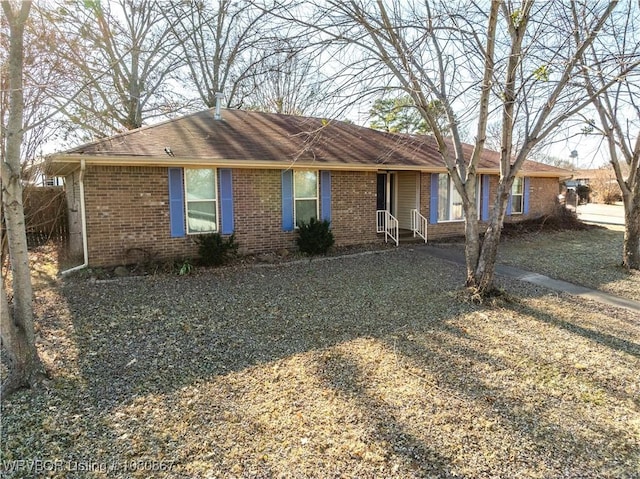 single story home with brick siding