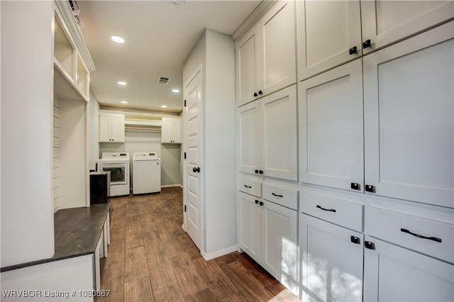 hall featuring washer and clothes dryer, dark wood finished floors, recessed lighting, and baseboards