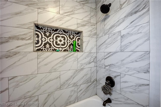 bathroom view of shower / washtub combination