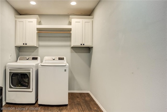 washroom with washing machine and clothes dryer, recessed lighting, dark wood finished floors, cabinet space, and baseboards