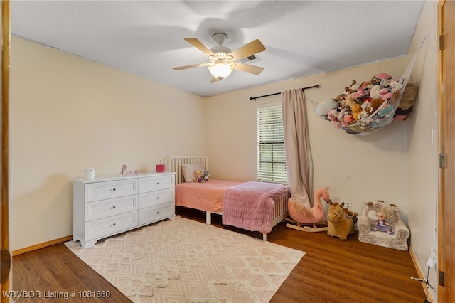 103 Bowlin Dr, Poteau, OK 74953 - bedroom with light wood-style flooring and ceiling fan