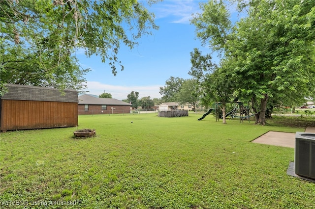 103 Bowlin Dr, Poteau, OK 74953 - view of yard with an outdoor fire pit and a storage shed