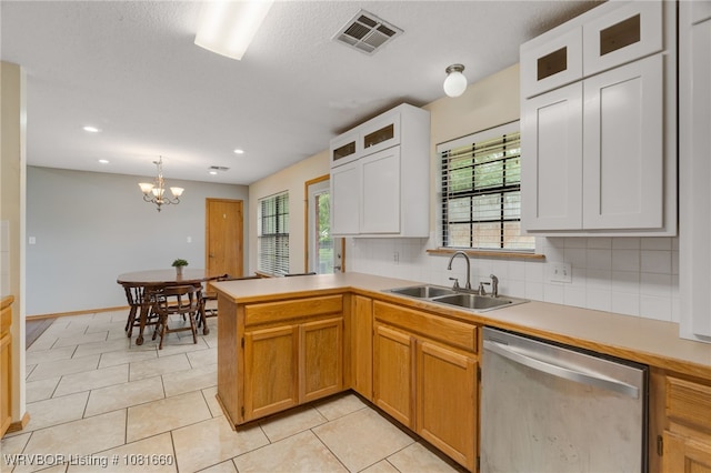 103 Bowlin Dr, Poteau, OK 74953 - kitchen with dishwasher, plenty of natural light, a peninsula, light countertops, and recessed lighting