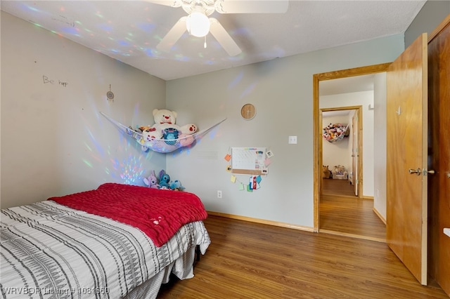 103 Bowlin Dr, Poteau, OK 74953 - bedroom with wood finished floors and ceiling fan