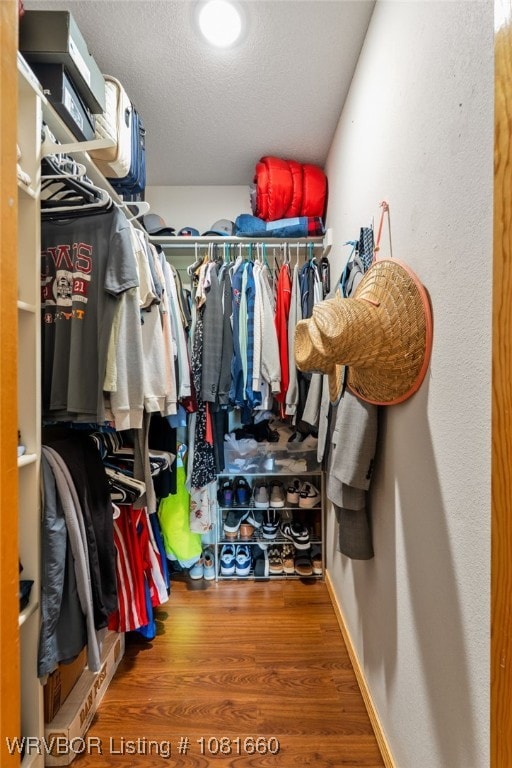 103 Bowlin Dr, Poteau, OK 74953 - spacious closet featuring wood finished floors