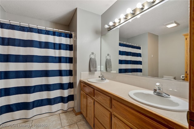 103 Bowlin Dr, Poteau, OK 74953 - full bath with double vanity, tile patterned floors, a textured ceiling, and a shower with curtain