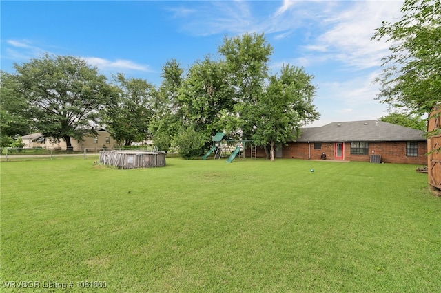 103 Bowlin Dr, Poteau, OK 74953 - view of yard featuring a playground and an outdoor pool