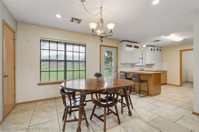 103 Bowlin Dr, Poteau, OK 74953 - dining room with plenty of natural light, recessed lighting, light tile patterned floors, a chandelier, and washer / clothes dryer