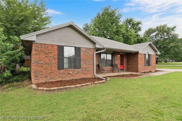 103 Bowlin Dr, Poteau, OK 74953 - ranch-style home featuring brick siding, a front lawn, and covered porch