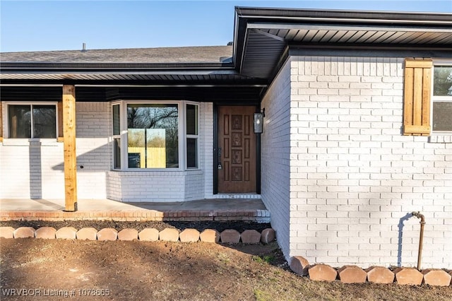 entrance to property with a porch