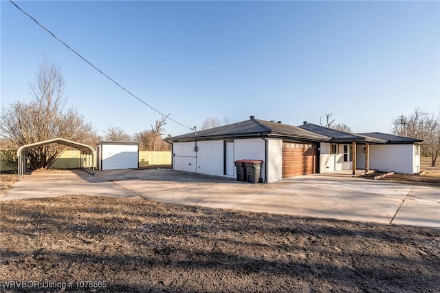 view of front facade with a carport and a garage