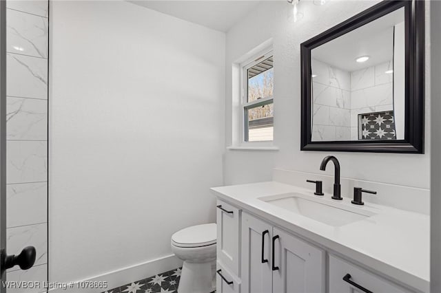 bathroom with vanity and toilet