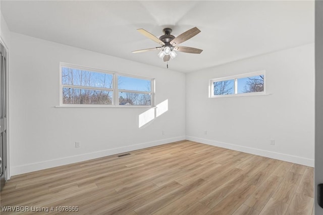 unfurnished room featuring ceiling fan and light hardwood / wood-style flooring