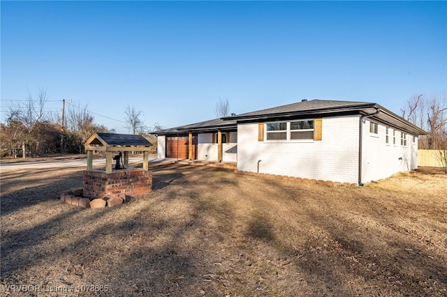 ranch-style home with a carport