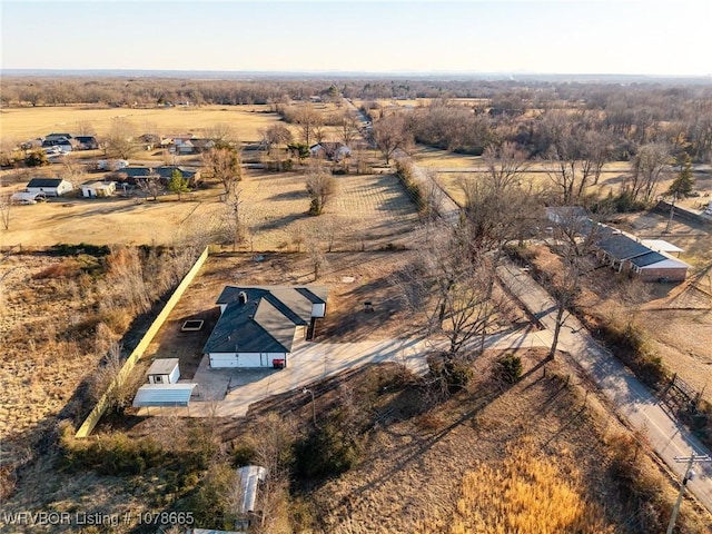 birds eye view of property featuring a rural view