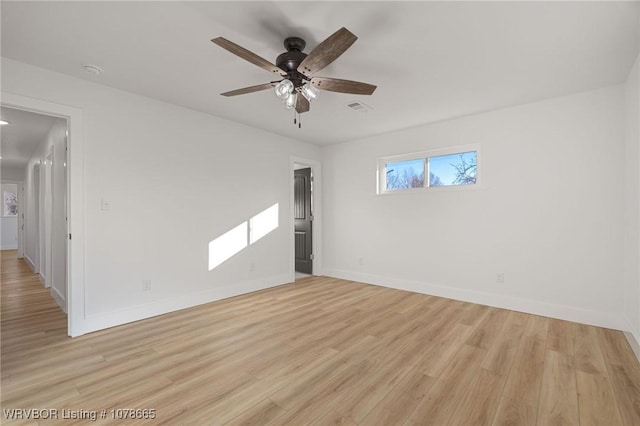 spare room featuring ceiling fan and light hardwood / wood-style floors