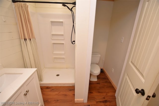 98926 S 4610th Rd, Marble City, OK 74945 - full bath with a shower stall, wood finished floors, toilet, and vanity