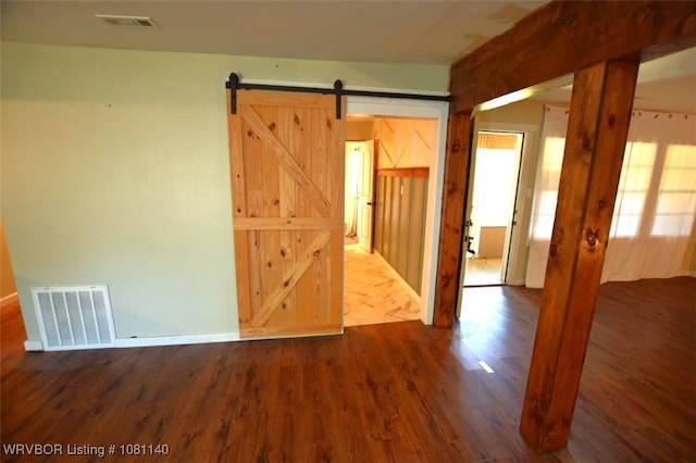 98926 S 4610th Rd, Marble City, OK 74945 - empty room with dark wood-type flooring and a barn door