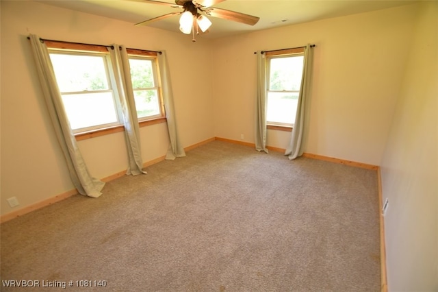 98926 S 4610th Rd, Marble City, OK 74945 - empty room featuring ceiling fan, plenty of natural light, light carpet, and baseboards