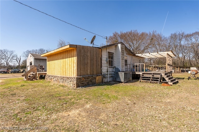 view of home's exterior with a pergola