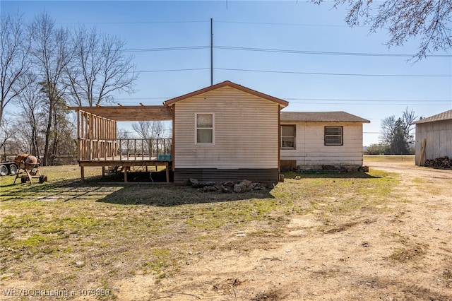 rear view of house with a deck