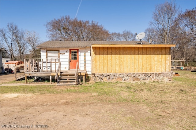 back of property featuring a deck