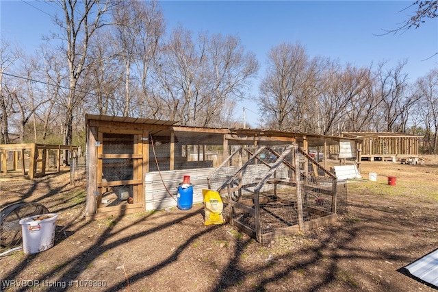 view of playground with exterior structure and an outbuilding