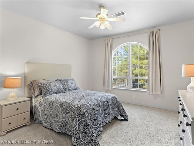 bedroom featuring light carpet and ceiling fan