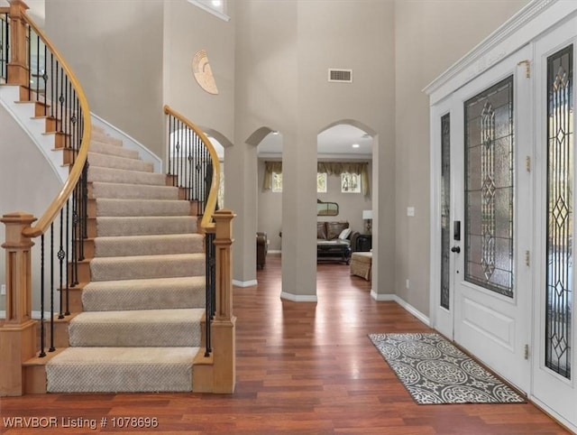 foyer entrance featuring dark hardwood / wood-style flooring