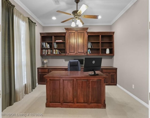 carpeted office space with crown molding and ceiling fan