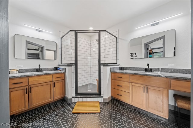 full bathroom featuring recessed lighting, a sink, a stall shower, and two vanities