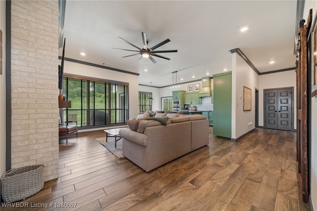 living room with recessed lighting, ceiling fan, ornamental molding, and dark wood-style flooring