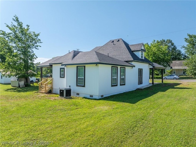 179 E Grove St, Magazine, AR 72943 - back of property with crawl space, a lawn, and roof with shingles