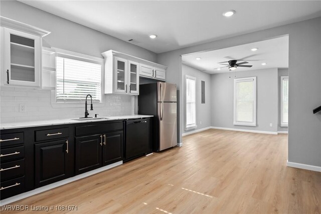 179 E Grove St, Magazine, AR 72943 - kitchen featuring black dishwasher, freestanding refrigerator, light countertops, white cabinets, and ceiling fan