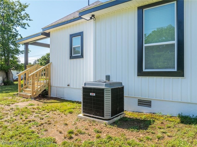 179 E Grove St, Magazine, AR 72943 - view of side of home with crawl space, stairway, and board and batten siding