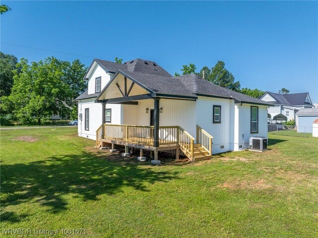 179 E Grove St, Magazine, AR 72943 - back of property with a lawn, a deck, roof with shingles, and crawl space