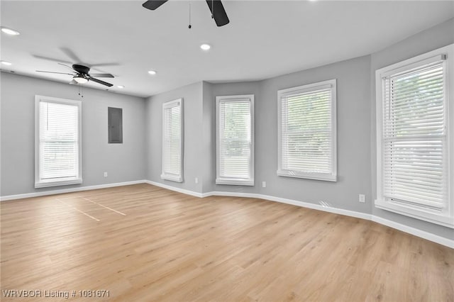 179 E Grove St, Magazine, AR 72943 - spare room with a ceiling fan, electric panel, recessed lighting, and light wood-style floors