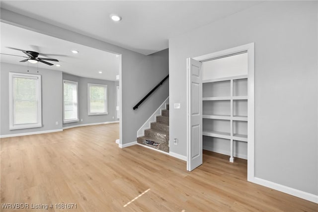 179 E Grove St, Magazine, AR 72943 - unfurnished living room with stairway, light wood-style floors, ceiling fan, and recessed lighting
