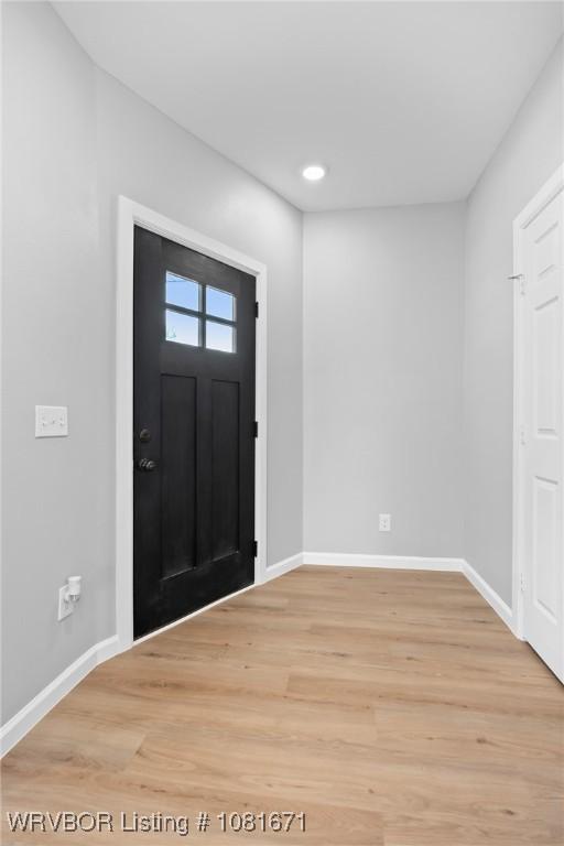 179 E Grove St, Magazine, AR 72943 - foyer entrance with light wood finished floors and recessed lighting